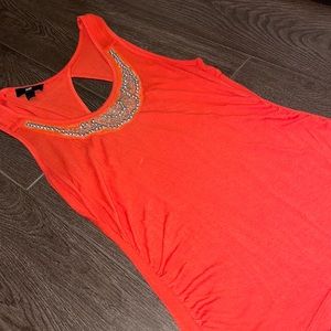 Bright orange stretchy embellished top